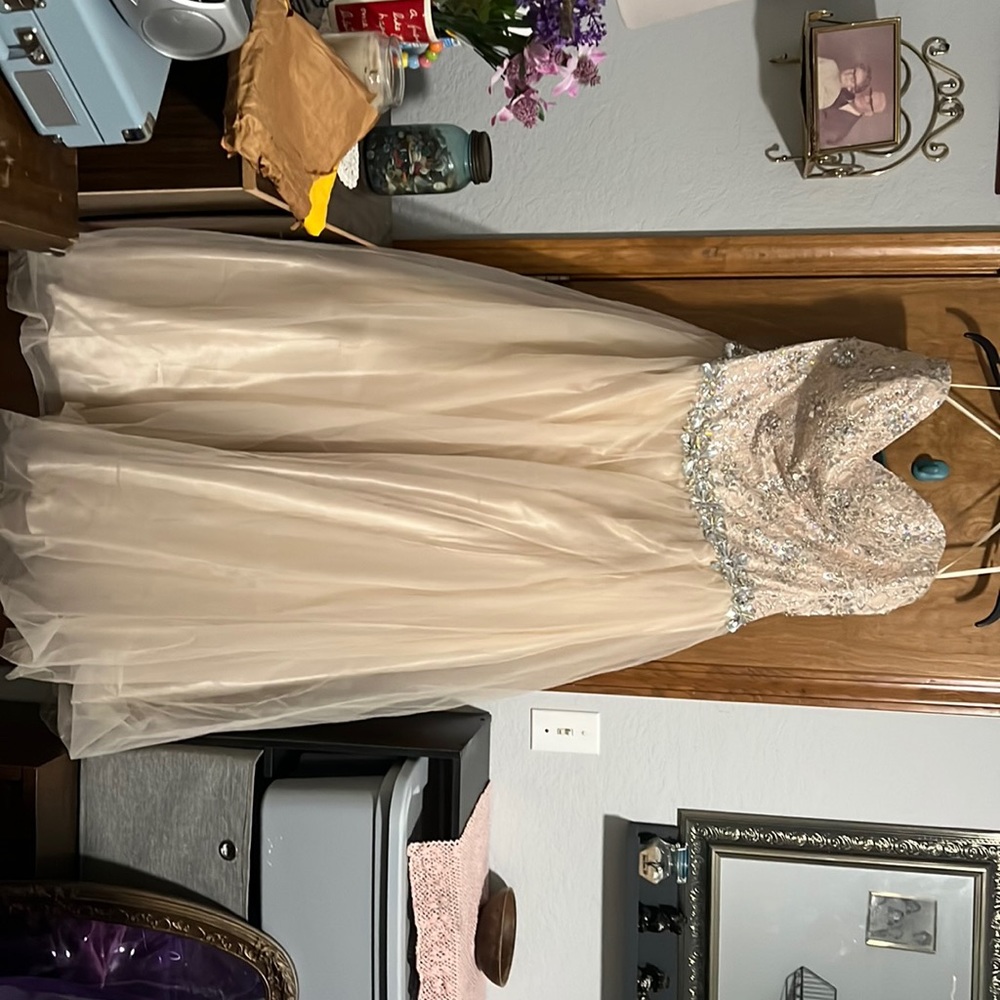 Beautiful beaded bodice strapless prom dress. Tull over bottom